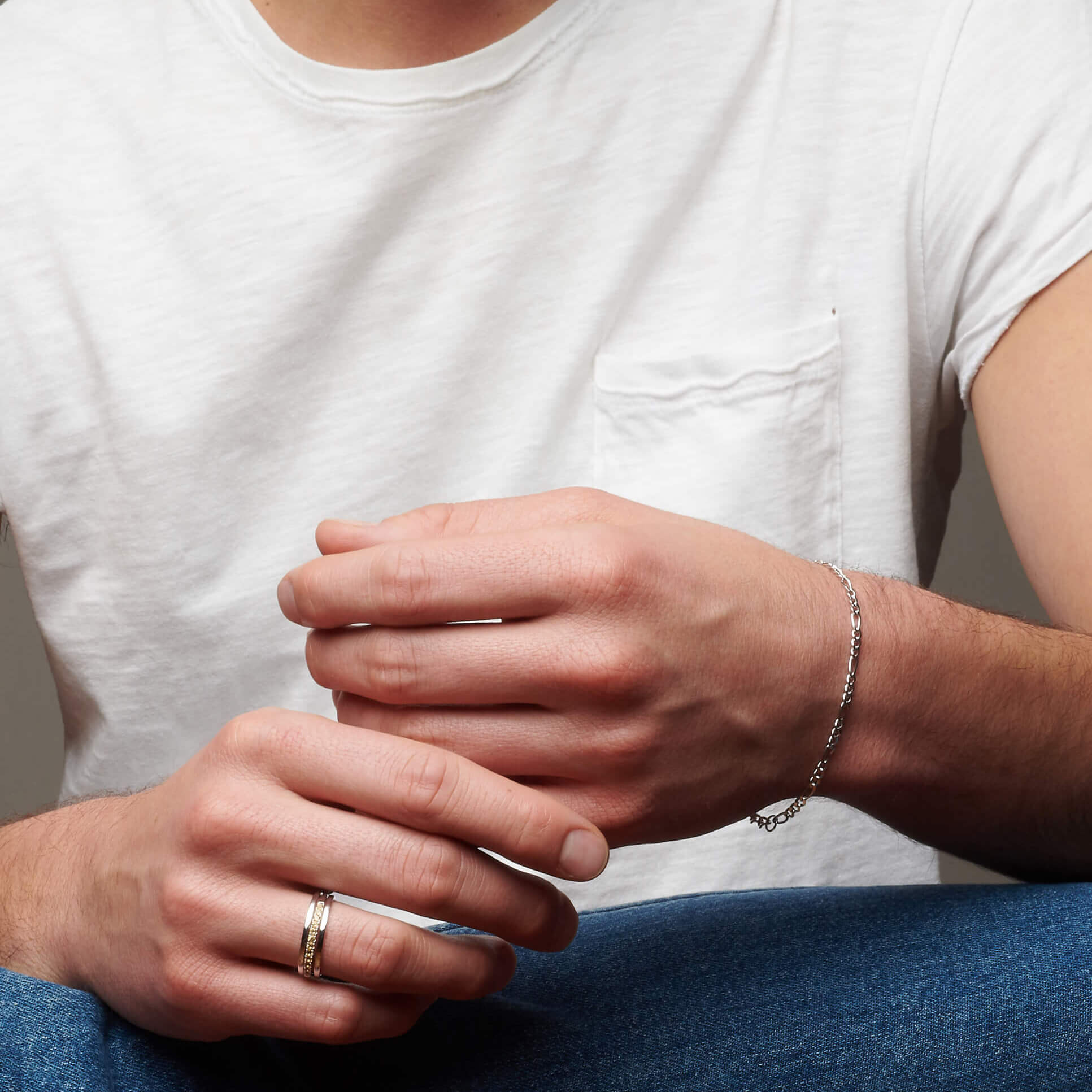 Man's hands with atelium silver bracelet