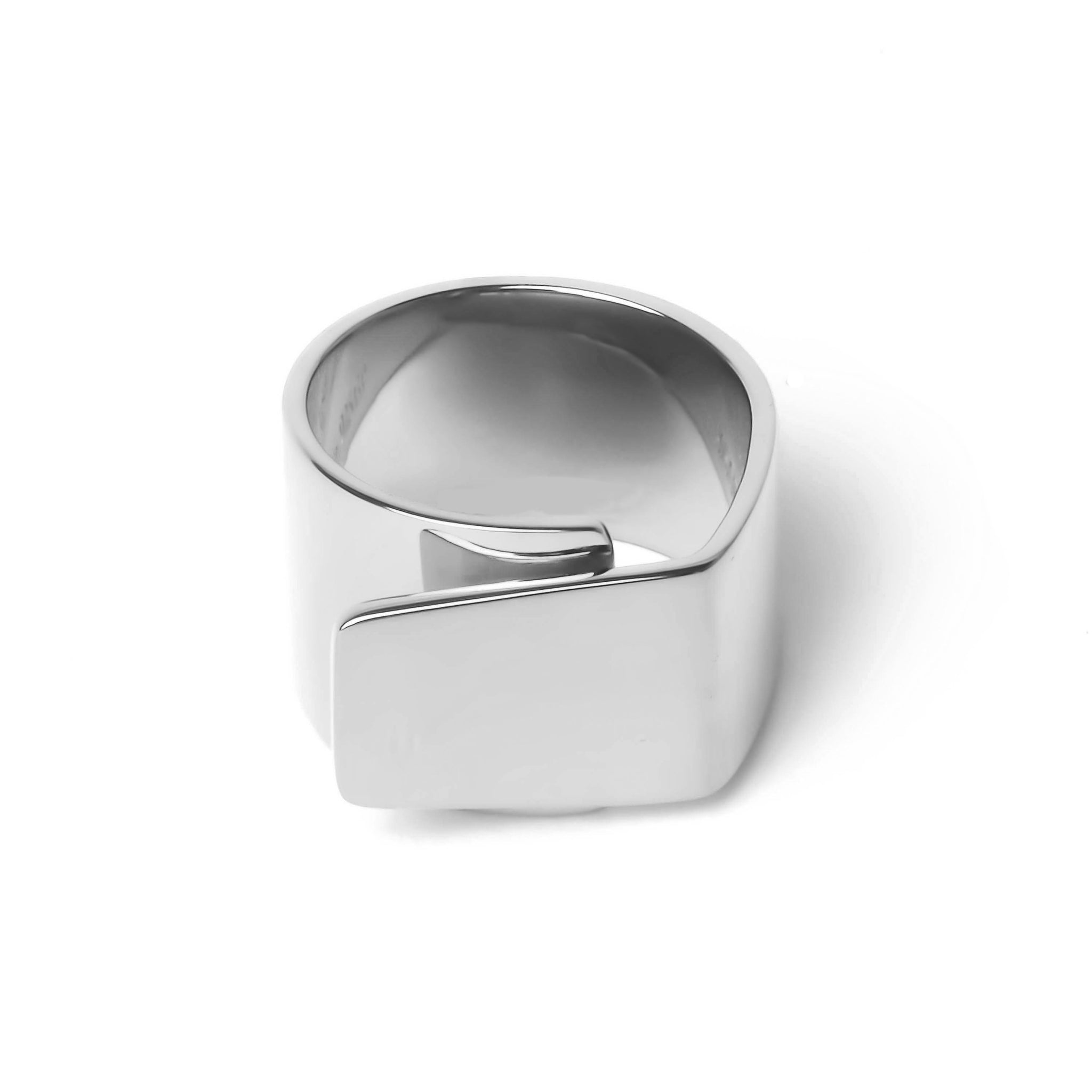 Wide silver ring with one side over lapping the other