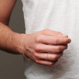 Up close image of man's hand wearing smoky quartz ring