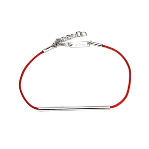 Red string bracelet with silver tube