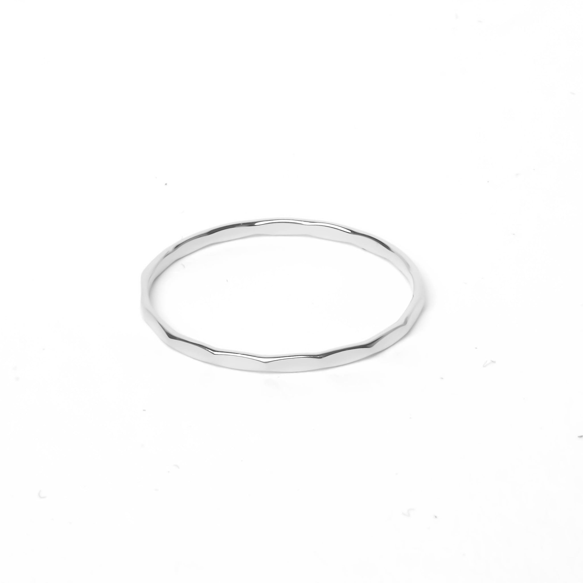 Silver flat ring with hammered groove decorations