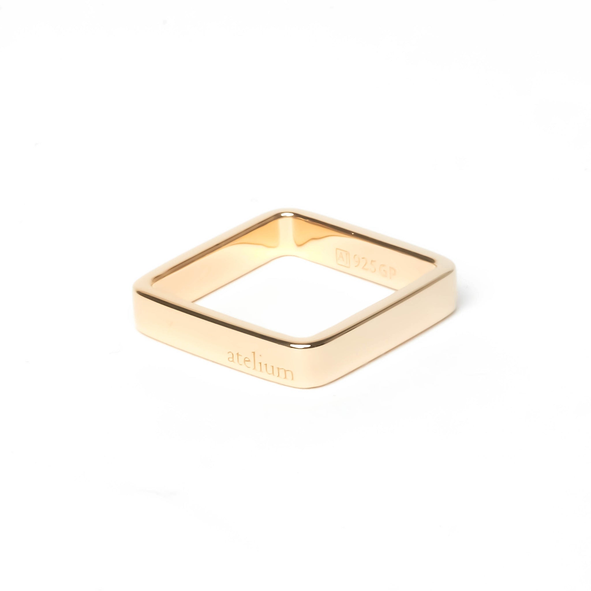 4 mm wide gold ring engraved with the brand name atelium