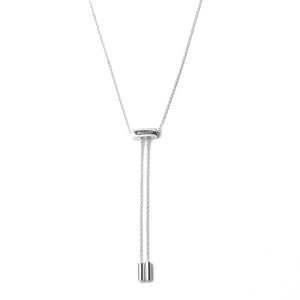 Back side of silver atelium tassel necklace with adjustable pull closure with the 2 ends of the necklace dangling 